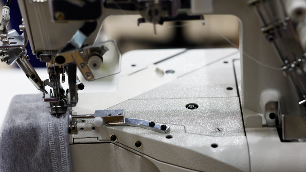 A close up photo of a serger sewing machine